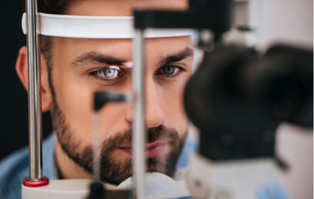 young man eye examination