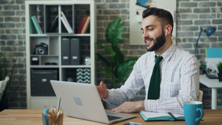 young man smiling at work